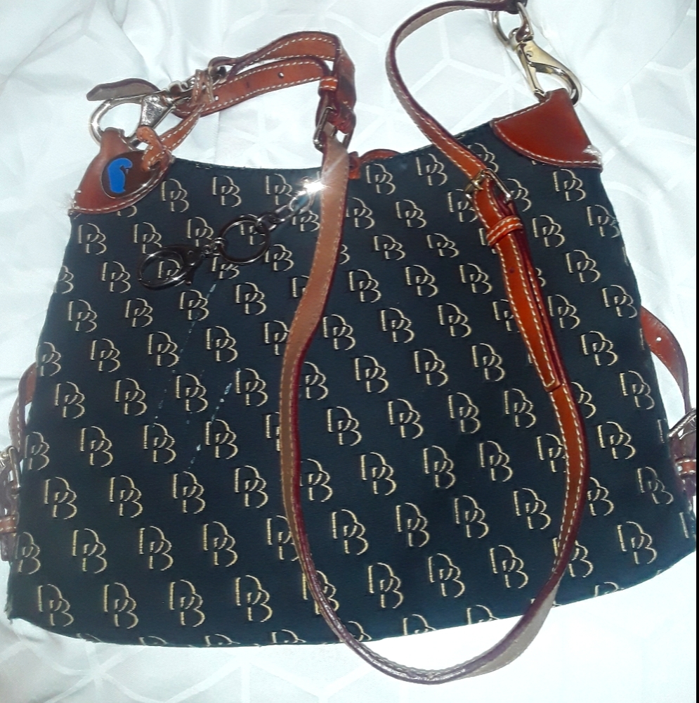 Dooney and Bourke long leather strap purse. Medium